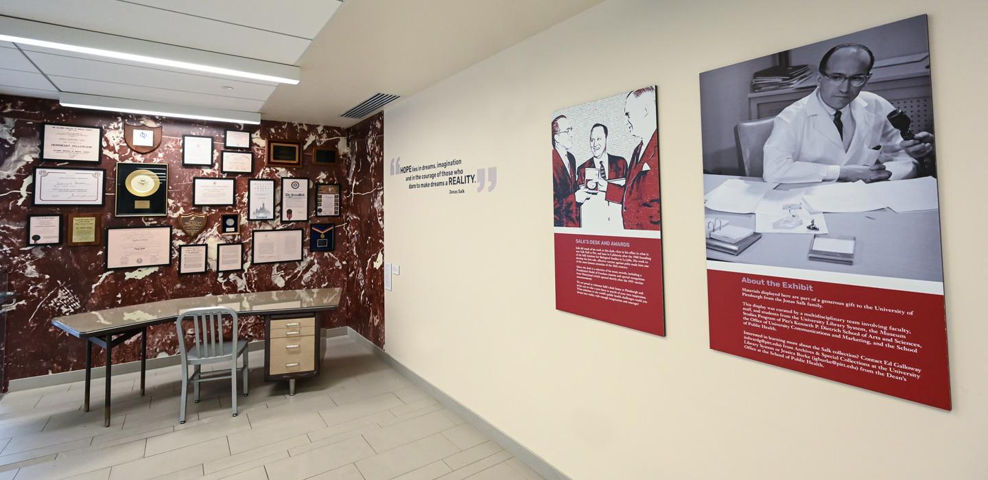 plaques and documents hung on the wall above Salk's desk