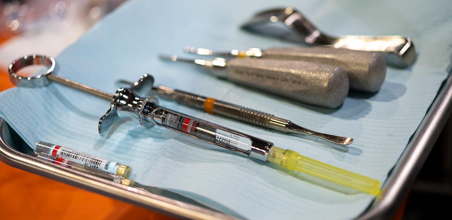 Dental tools on a silver tray