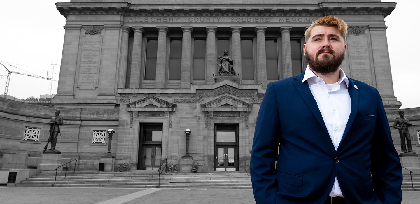 Rehbach stands in front of Soldiers and Sailors Memorial Hall and Museum