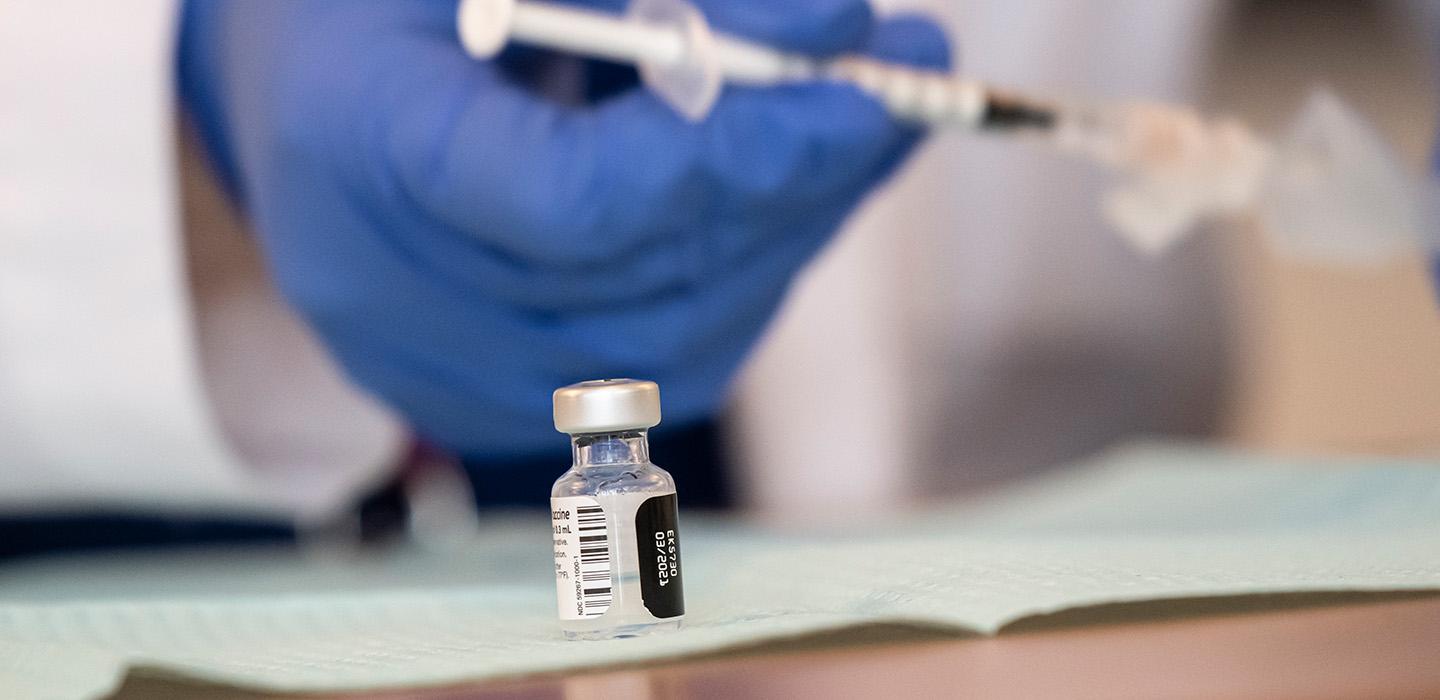 A small glass vaccine bottle