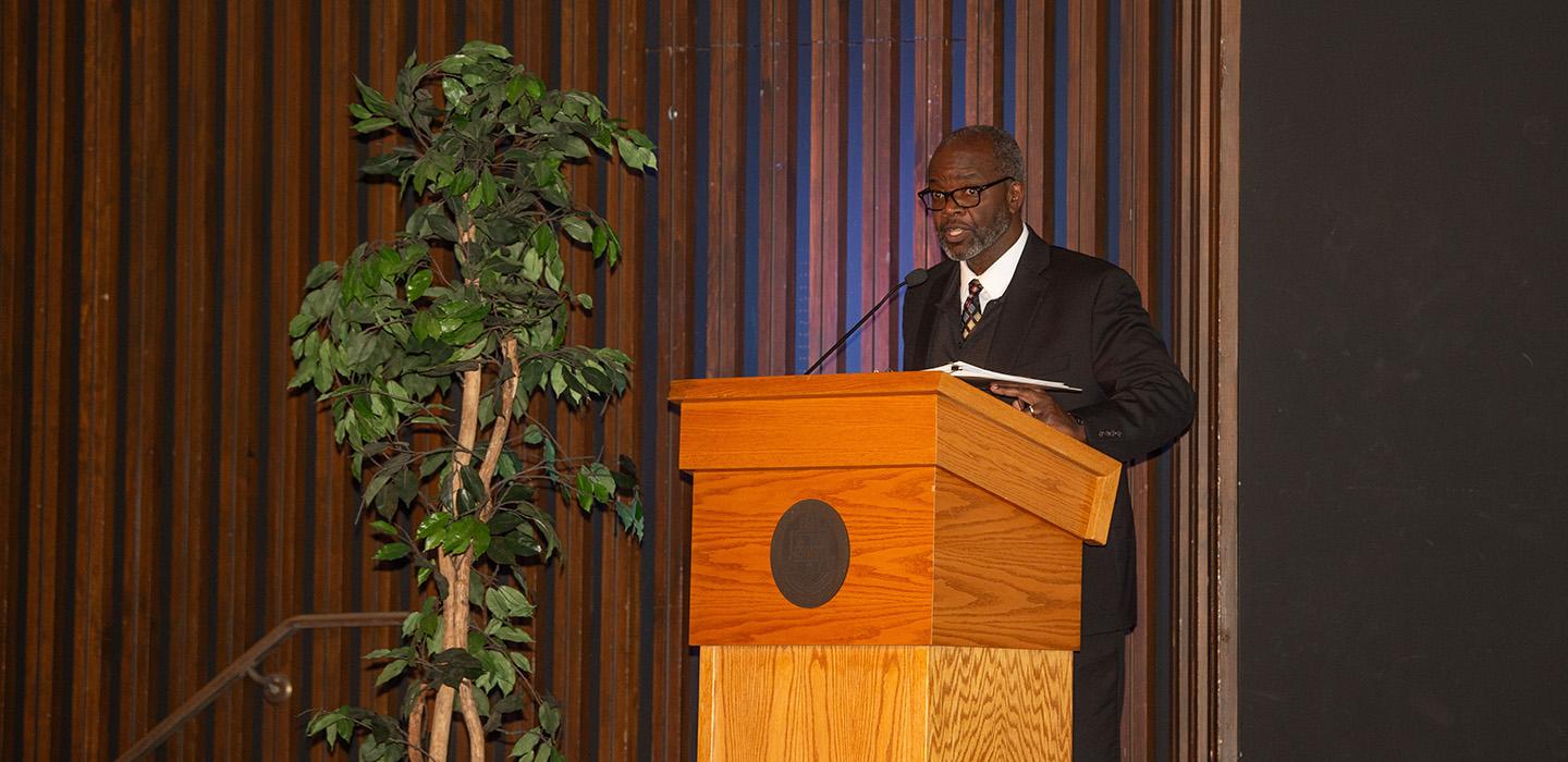A person speaks at a podium