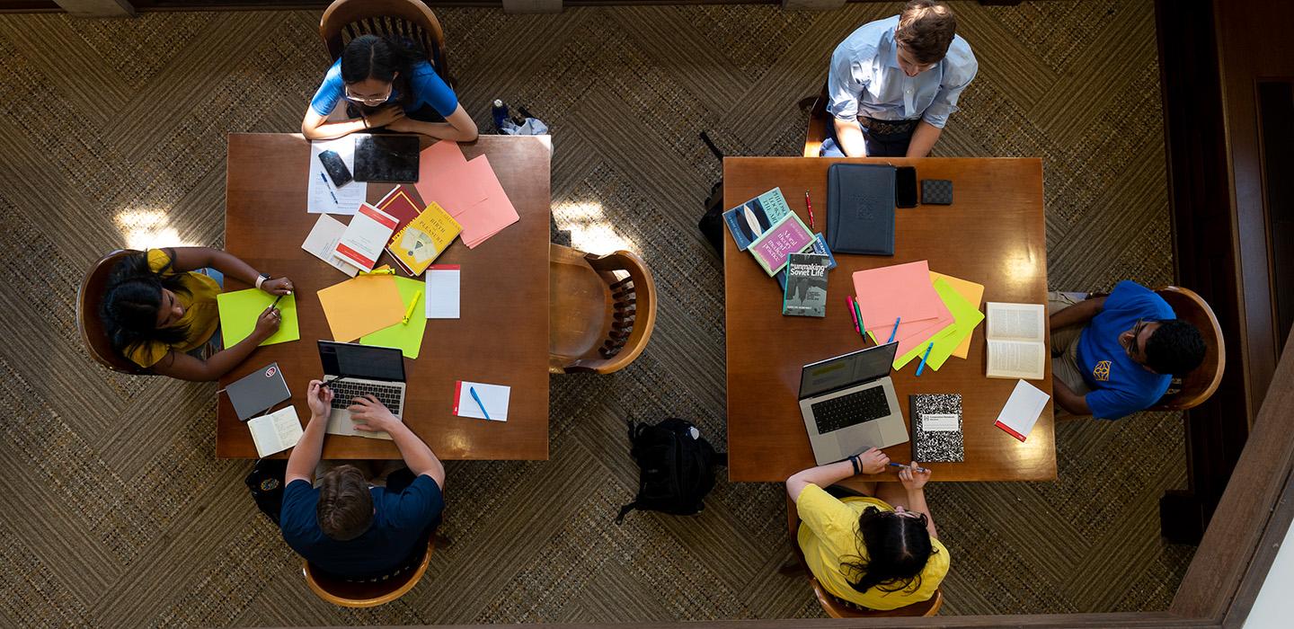 An overhead shots of students studying at two tables