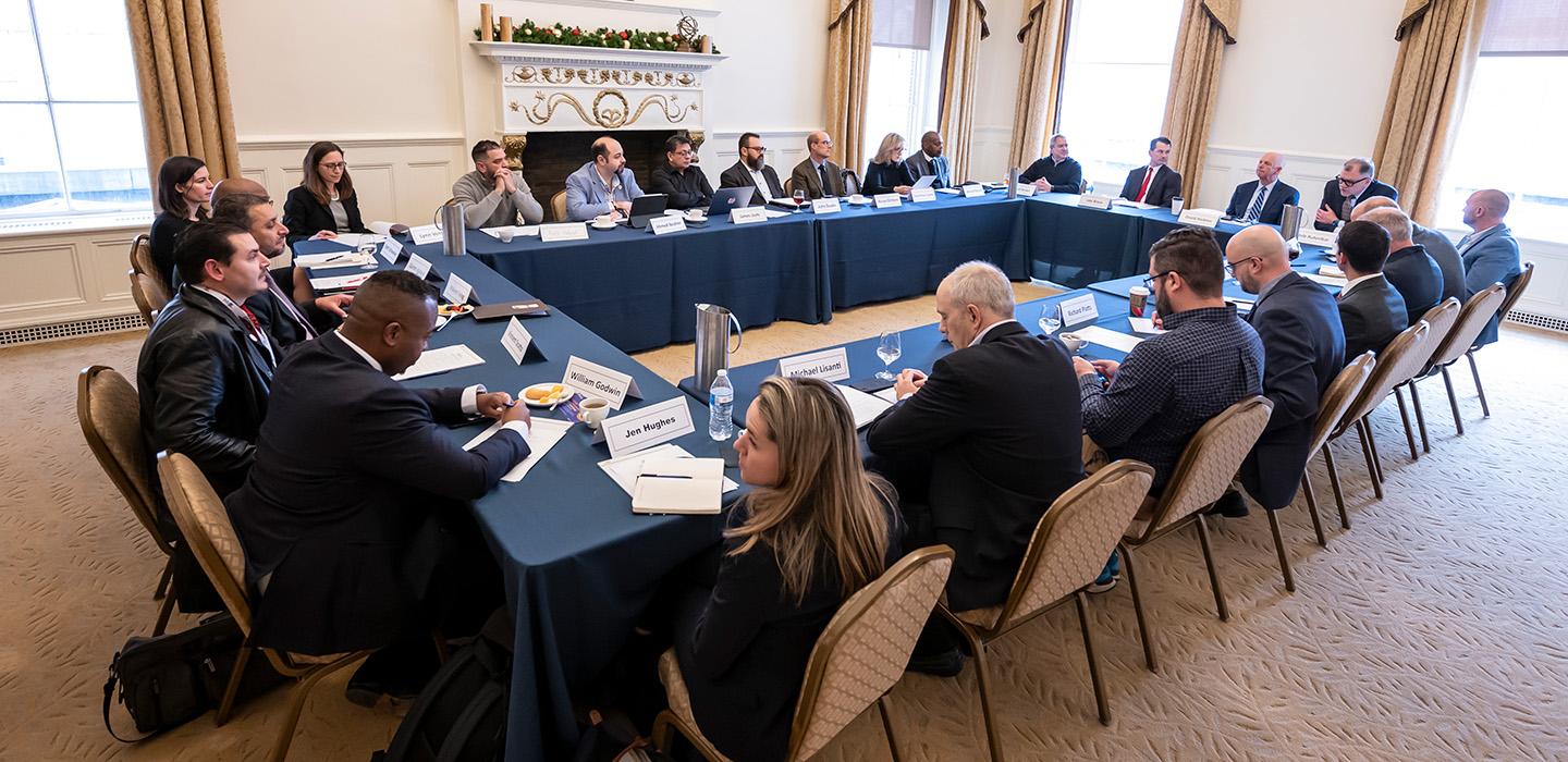 People sit around a large table