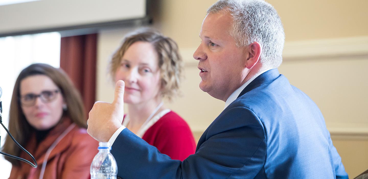 McCarthy speaks on a panel