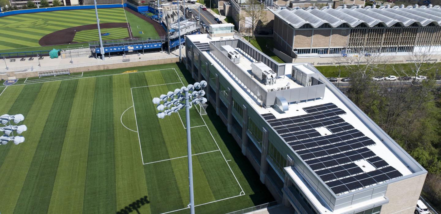 Aerial view of the Petersen Events Center, with rooftop solar panels 