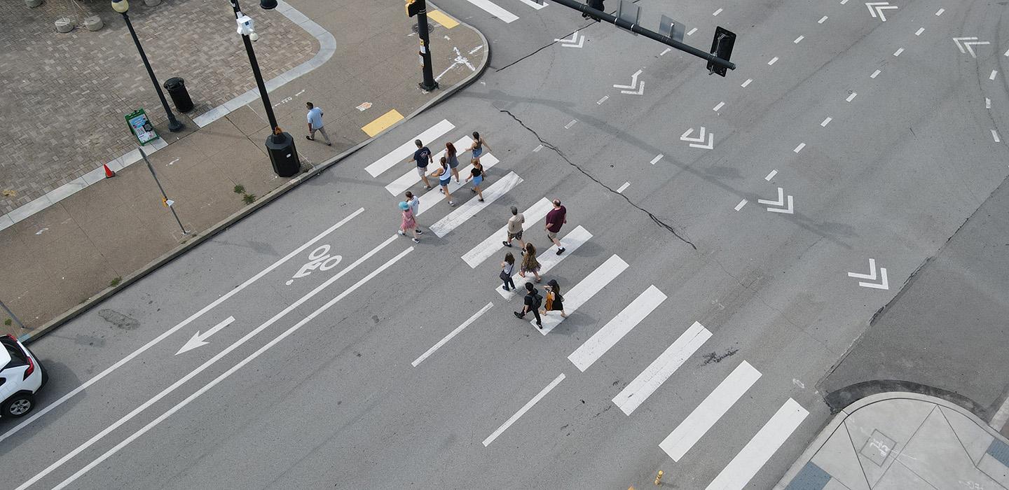 A drone photo of people using a crosswalk