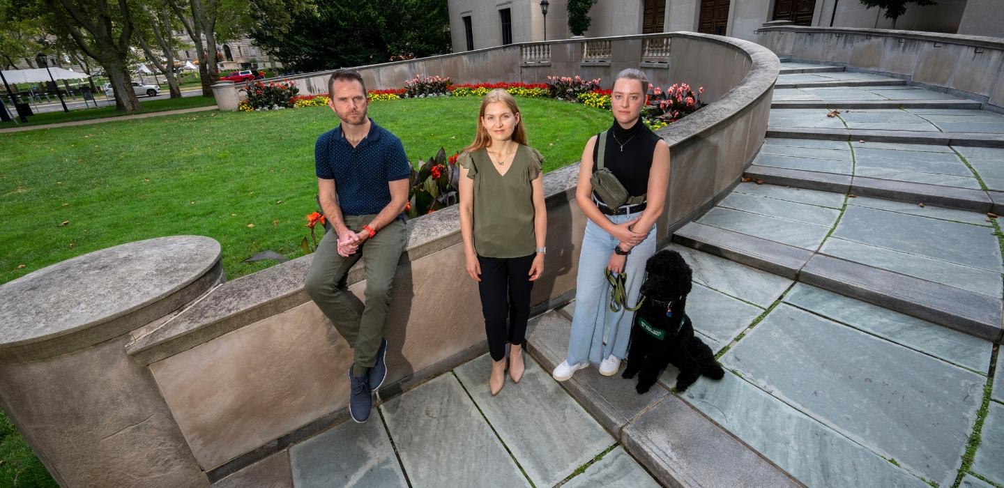 Individuals connected with Pitt's Disability Studies Certificate pose for a group portrait on the starts on Frick Fine Arts.