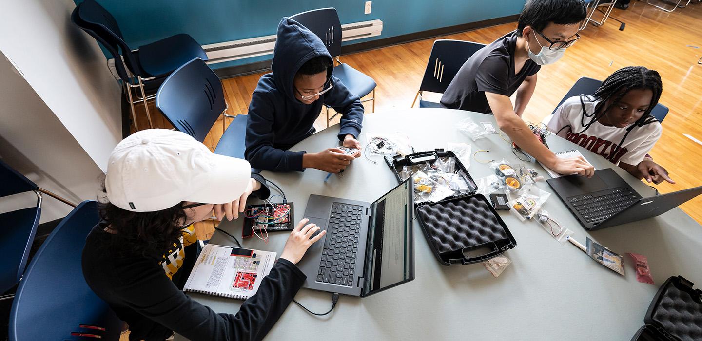 Students work on laptops a the CEC