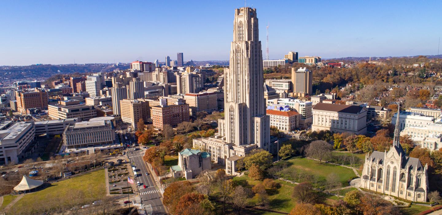 Aerial photo of the Cathedral of Learning, campus and Oakland.