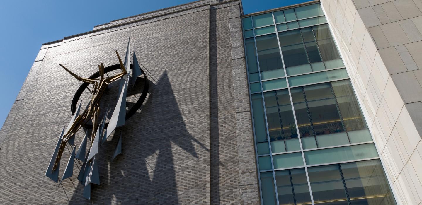 The front of the School of Public Health Building and sculpture.