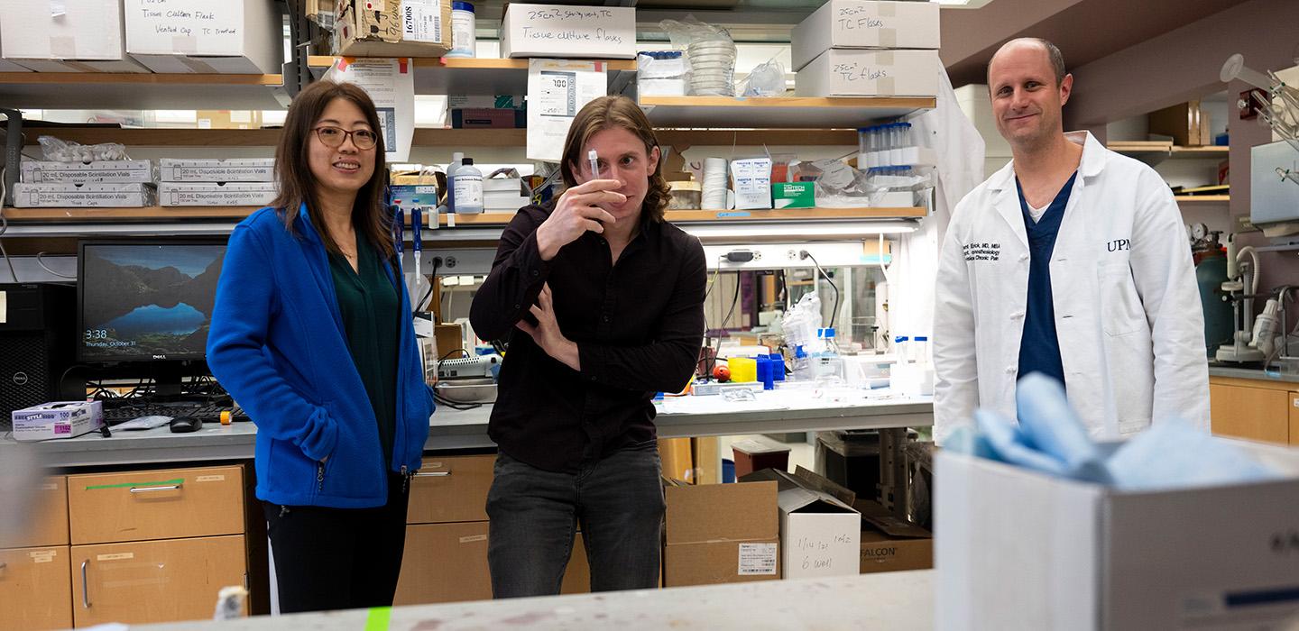 Three researchers in a lab