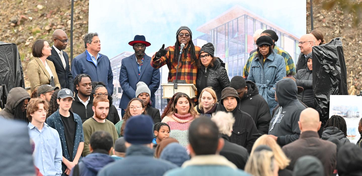 Community and Pitt speakers gather to speak to a crowd at an event at t at Hazelwood Avenue and Lytle Street, where it was announcement about the Hazelwood CEC was made.