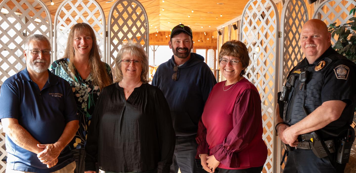 Pitt-Titusville employees (pictured, from left to right: Bill Watson, Patti Jo Young, Chris Hunt, Don Stuck, Dr. Stephanie Fiely and Ted Rougeux), pose for a group portrait to commemorate their milestone work anniversaries.