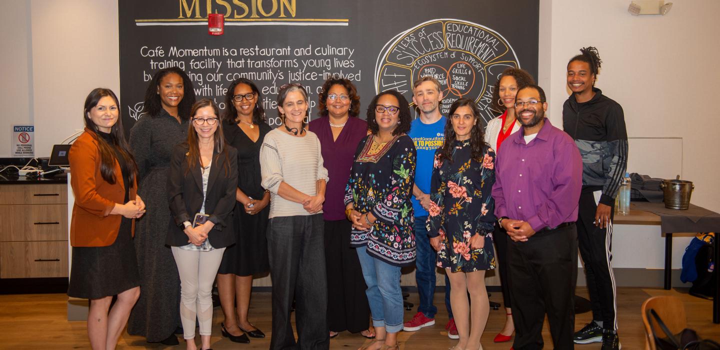 The Nonprofit Capacity Building Program cohort poses for a group photo at Café Momentum.
