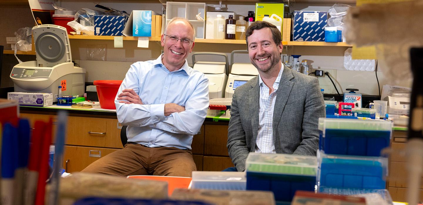 Alexander Deiters and Jason Lohmueller in the lab