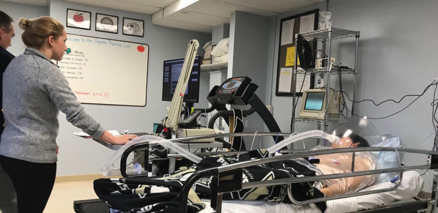 Applied Physiology Lab researchers conduct a spaceflight hibernation study on a volunteer.