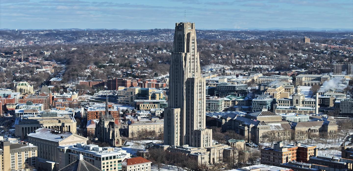 Winter drone imagery of the Cathedral of Learning and campus.