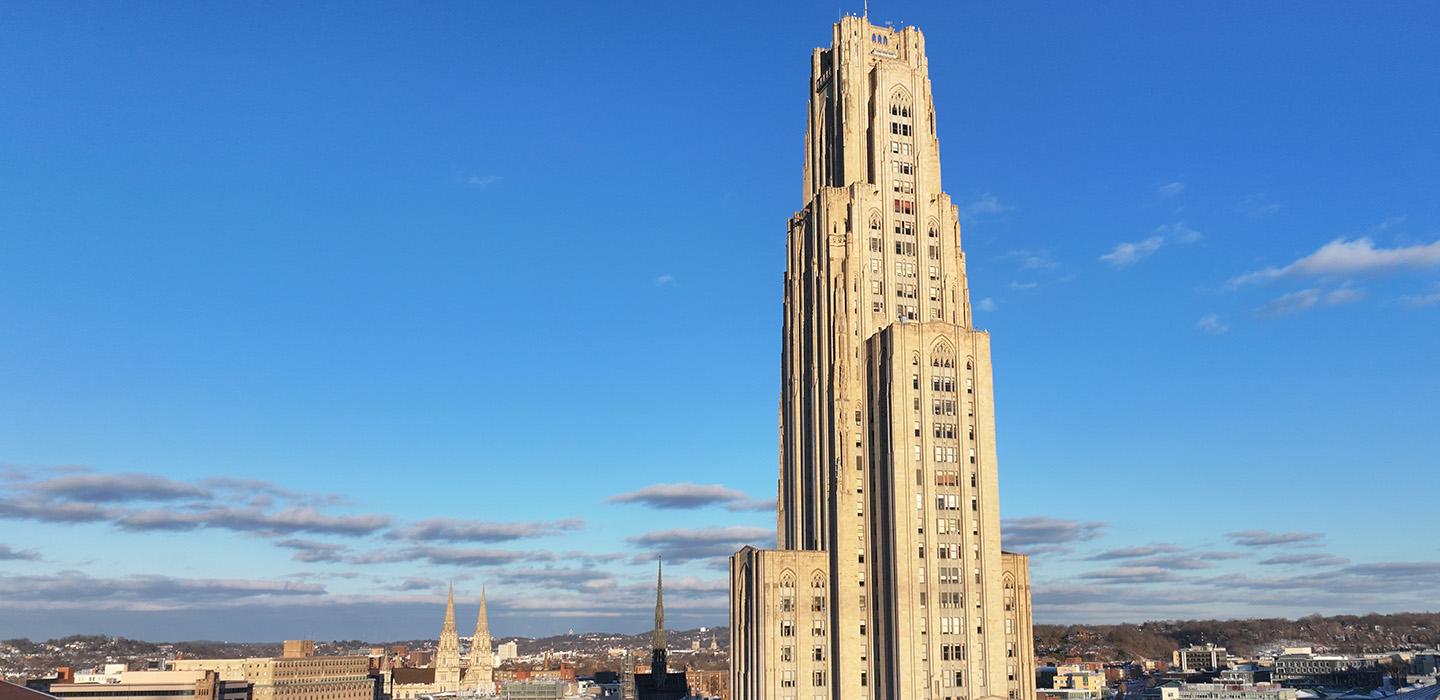 The Cathedral of Learning against a blue sky
