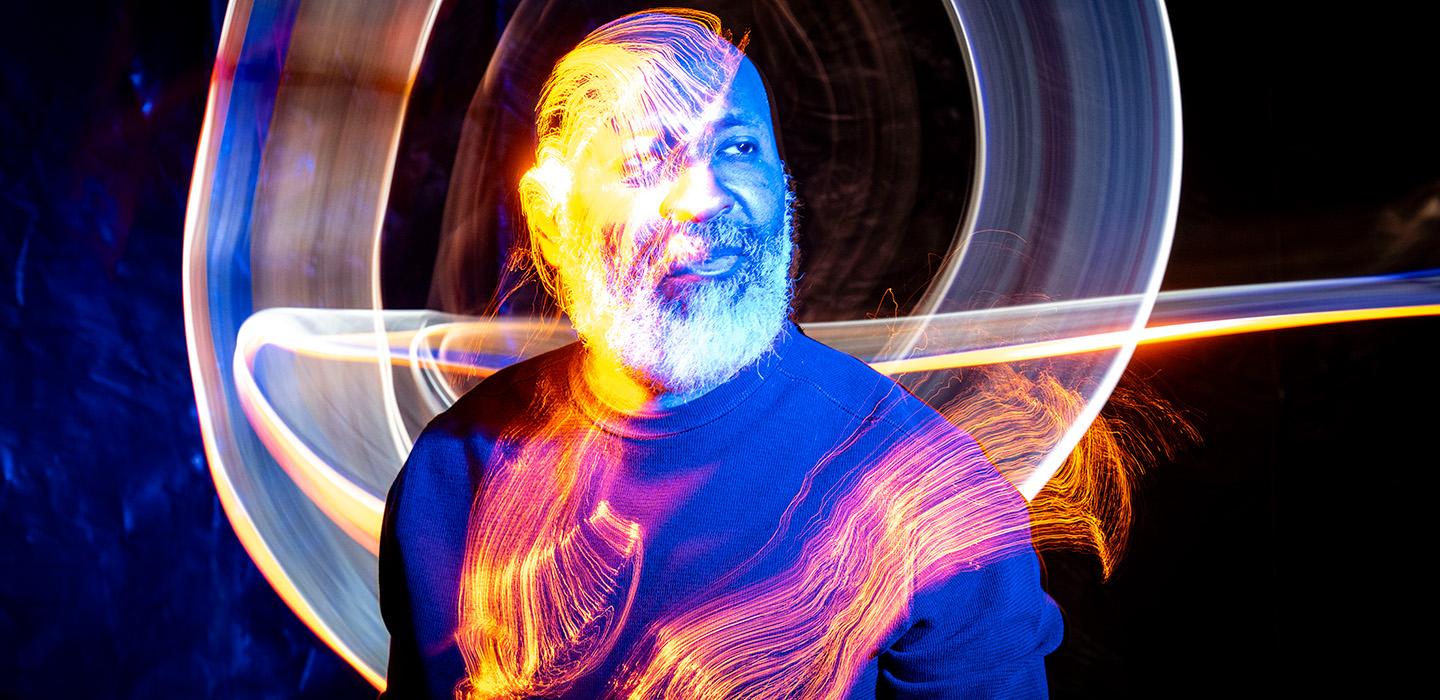 A portrait of Jackson with illustrated light effects
