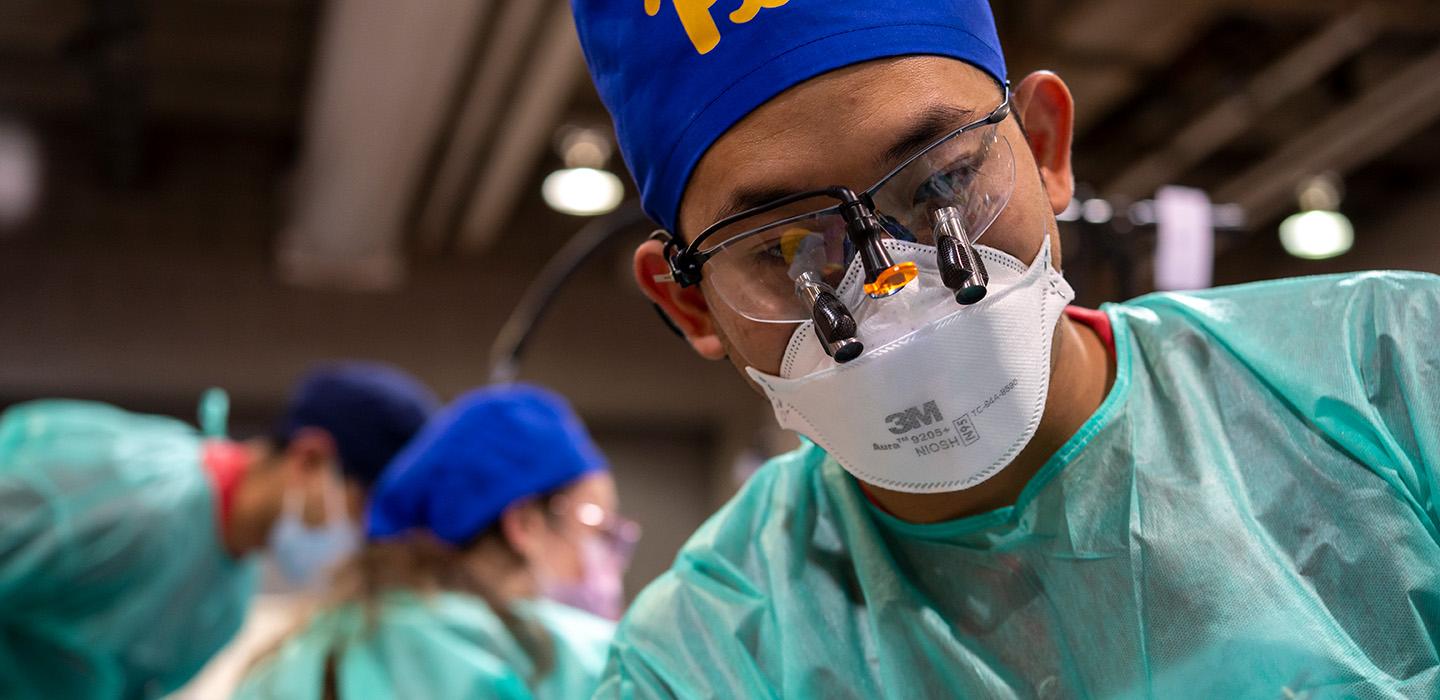 Dental techincian with mask and glasses