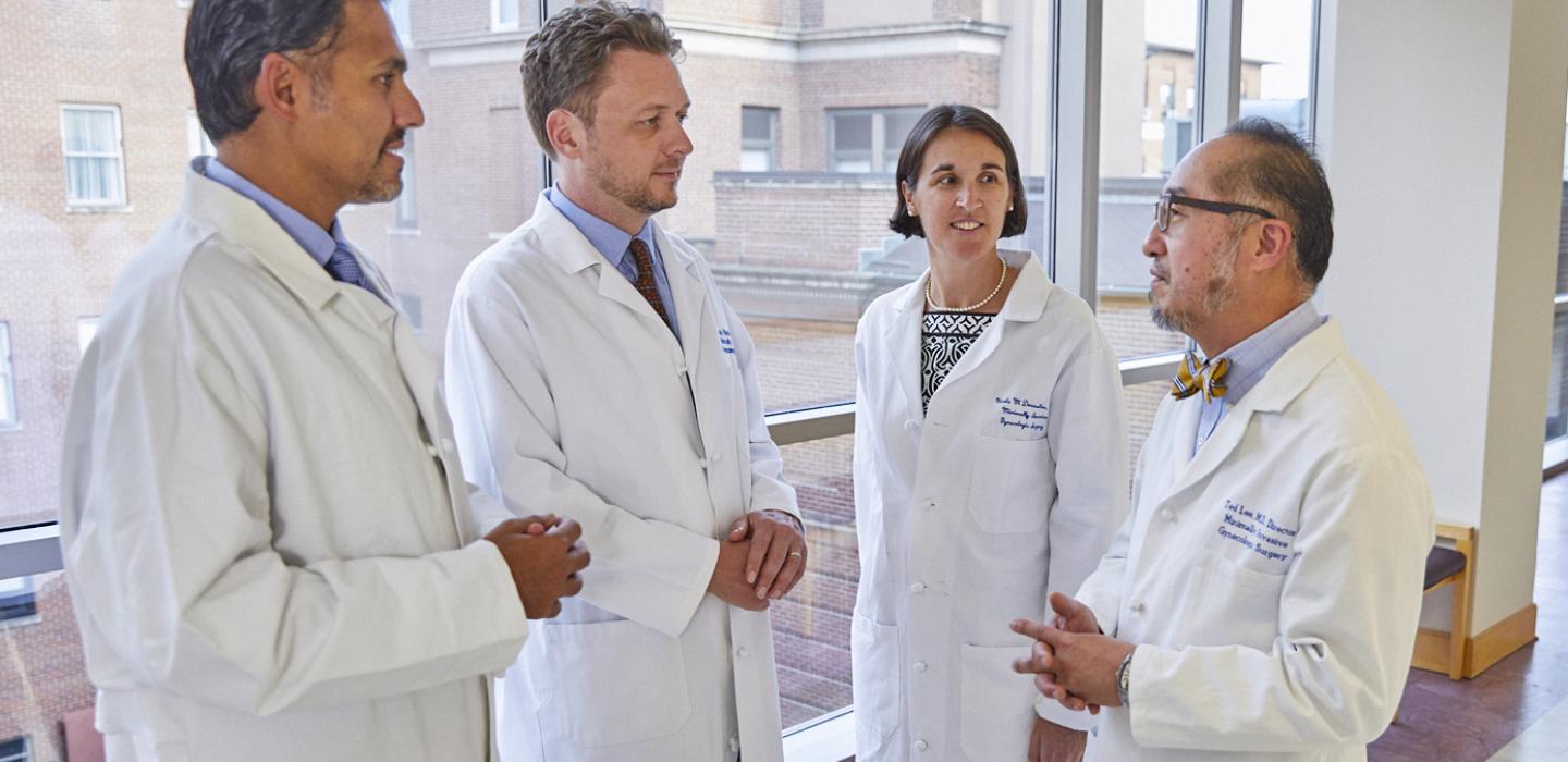 Doctors conversing in white coats