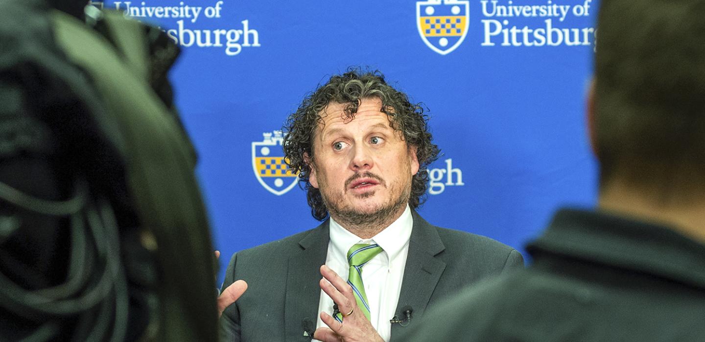 Paul Duprex in a suit and green tie