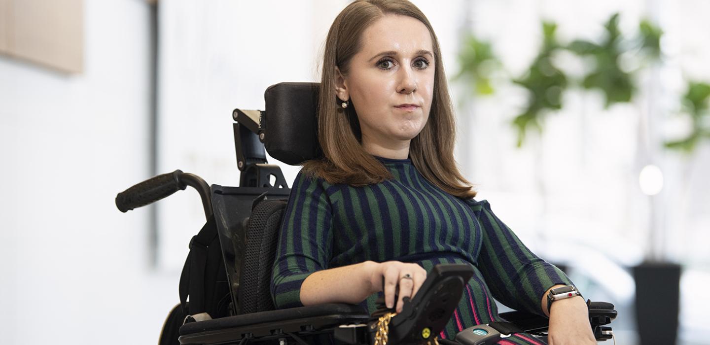 Heather Tomko in a green and black shirt