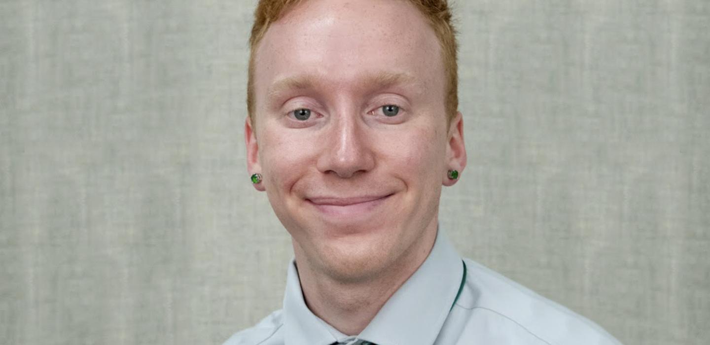 Freitag in a light blue shirt and aqua tie