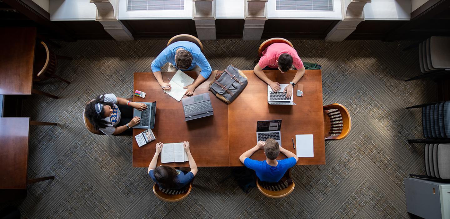 Table with 5 people seen from above