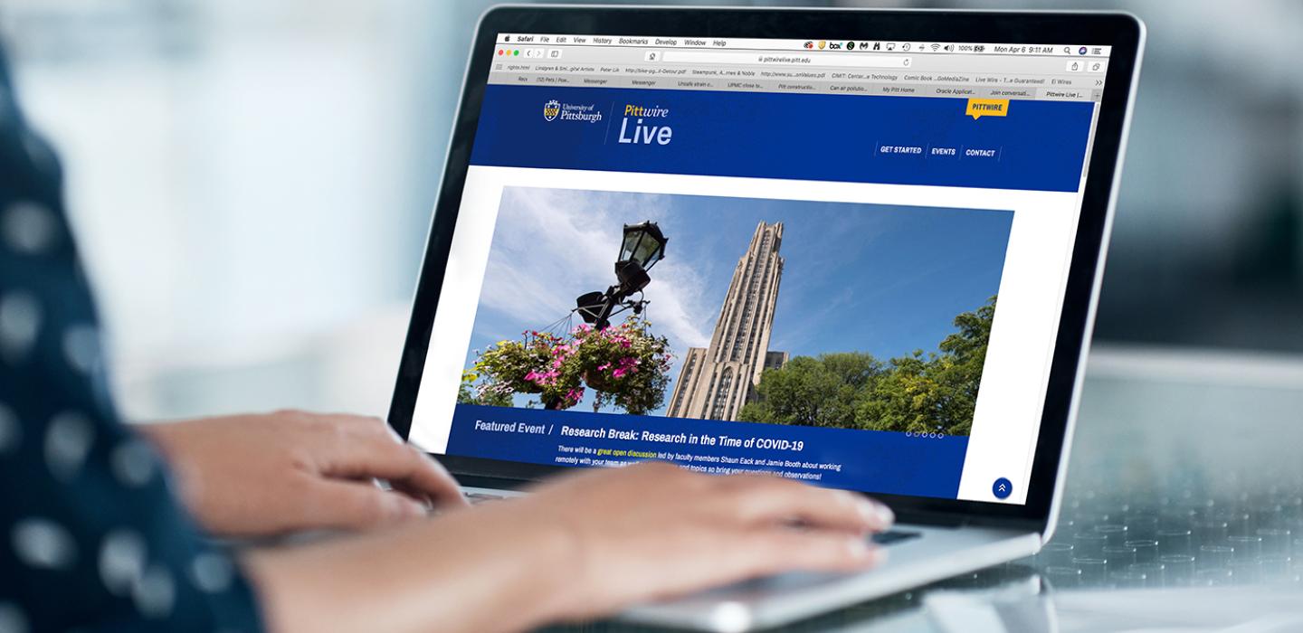 A person browses Pittwire Live on a computer