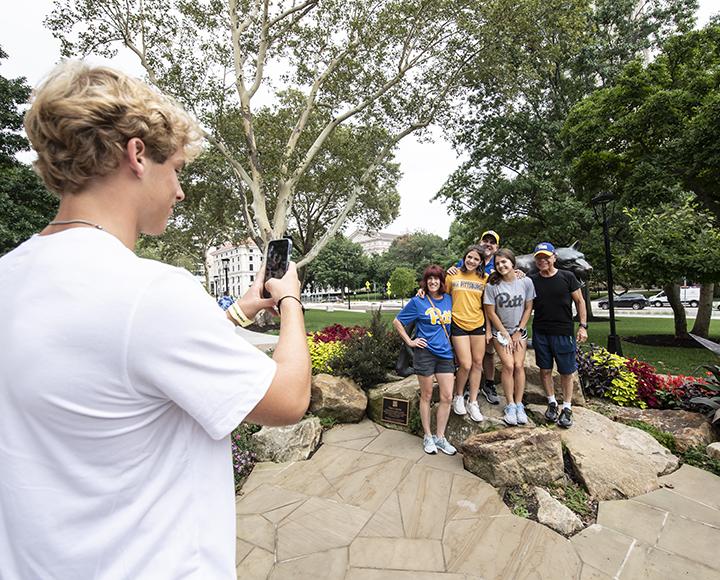 New Pitt arrivals taking group photo with panther statue