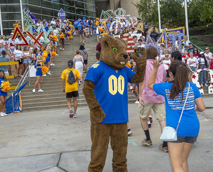 Roc greets students as they enter the Peterson Event Center