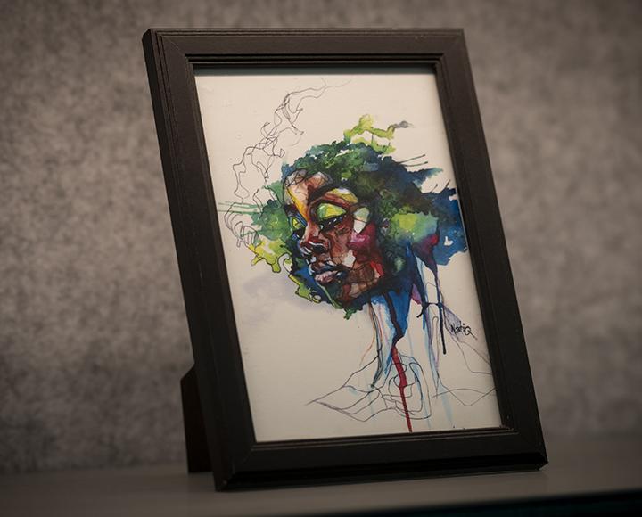 Colorful painting of face with eyes closed, white background