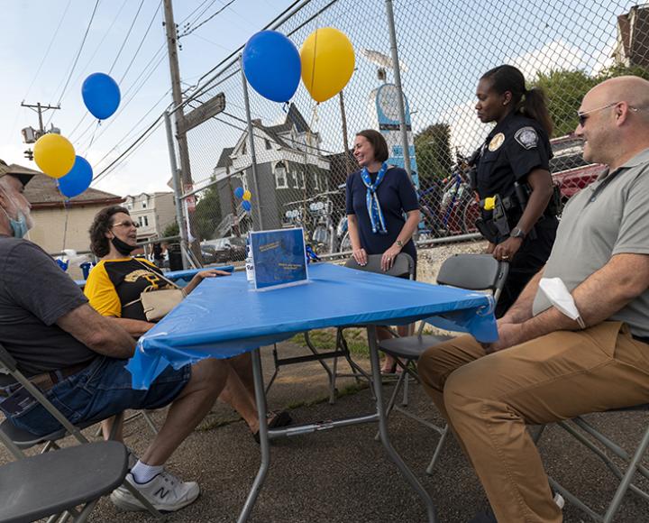 Jack and Linda Packard (left) chat with Associate Vice Chancellor for Community Engagement Lina Dostilio.