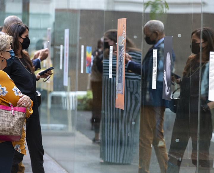 Attendees view a selection of artwork from the Black Lives in Focus exhibit