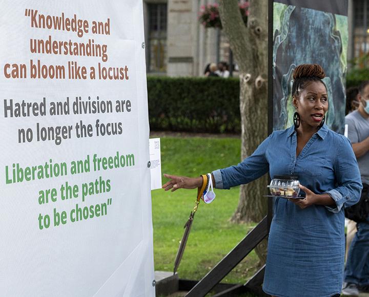 Lynda Brimage gestures at text contributed by Pittsburgh rapper Jordan Montgomery