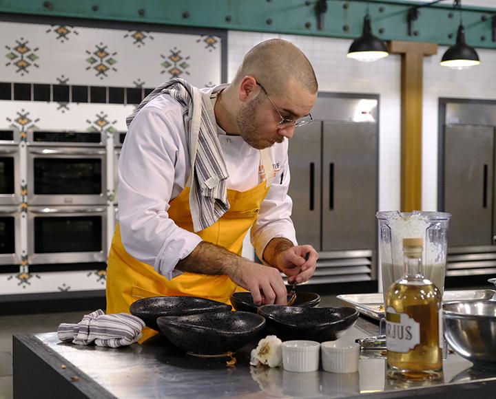 Brett Bankson cooking on the set of Top Chef