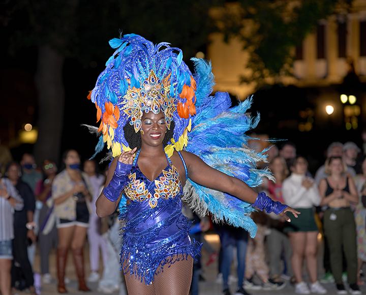 CLAS festival dancer with blue feathered outfit