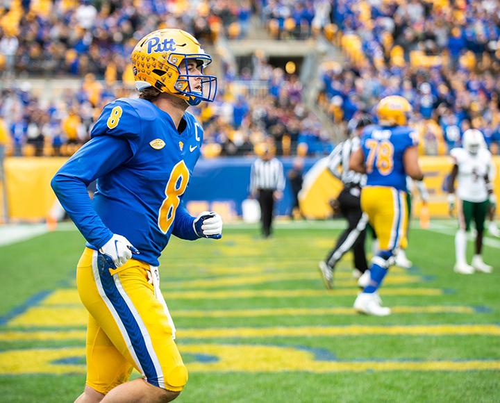 Kenny Pickett running during Pitt football game
