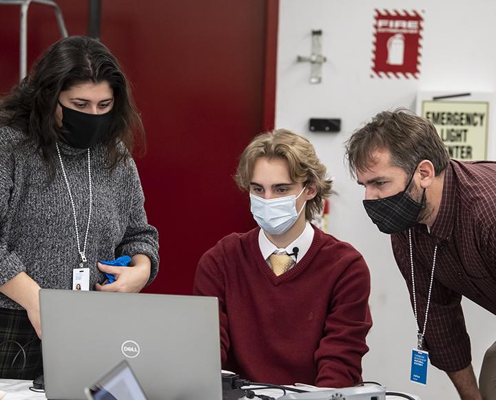 Pitt team looking at computer during 3D scanning