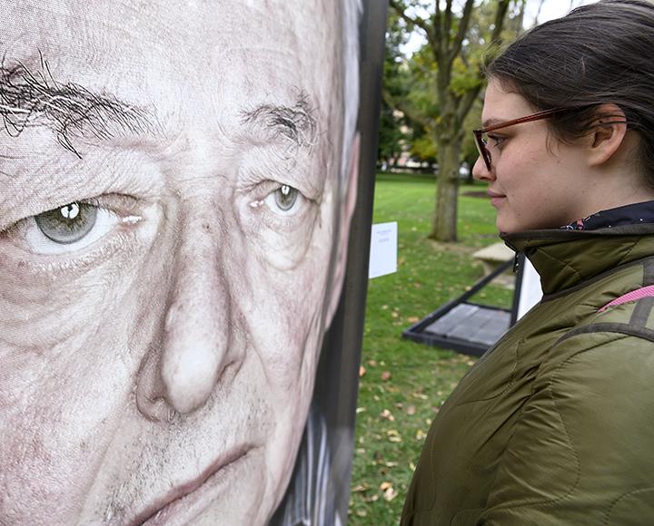 Student Maja Lynn before the "Lest We Forget" art installation