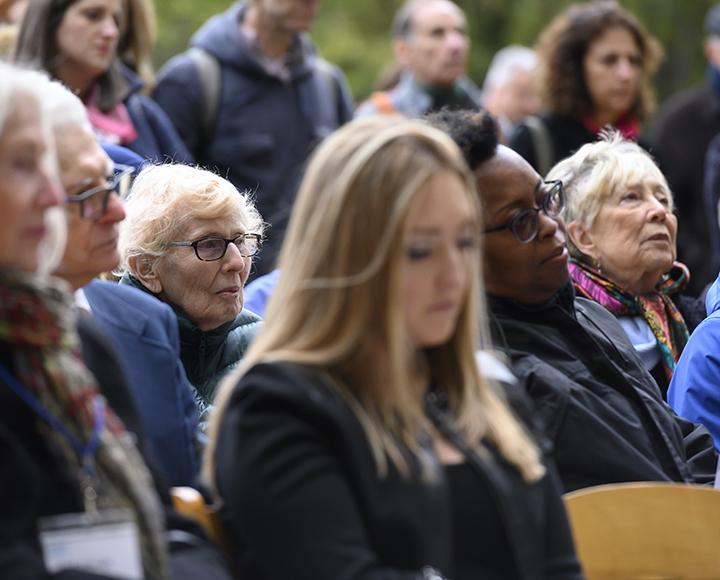 Audience sitting during "Lest We Forget" exhibit