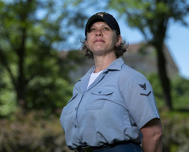 a woman in an Airforce ball cap and shirt