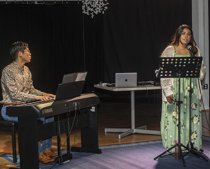 Pianist Thanakarn Limtham and singer Britney Yauger Limtham perform original songs.