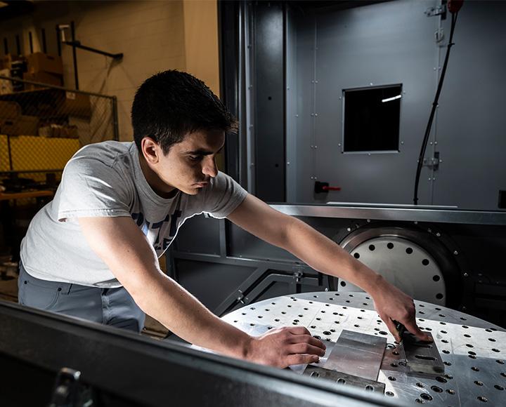 Jimenez handling metal pieces