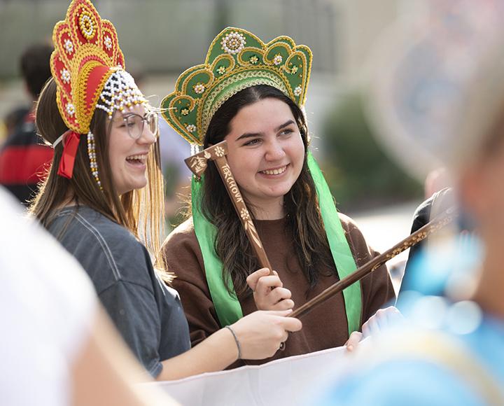 two students in headdresses