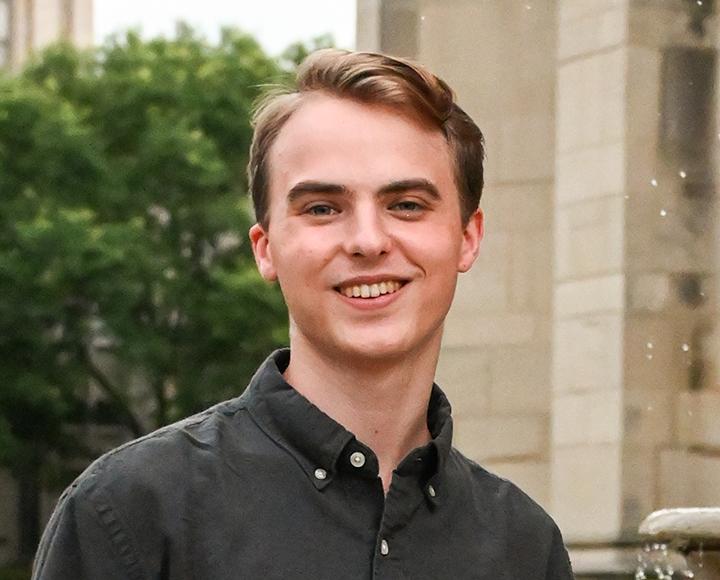 Wilhelmy in a dark collared shirt