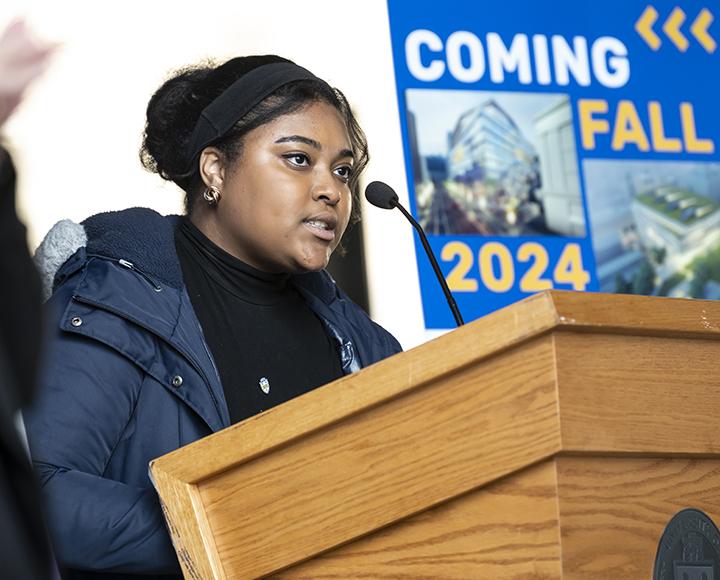 a student at a podium