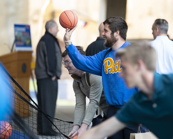 a student shooting a basketball