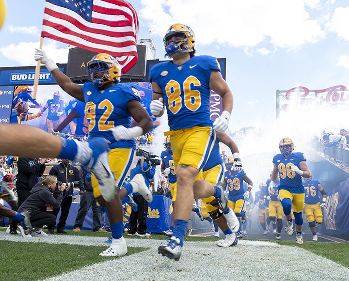 Players take the field at the start of their record-breaking win against Virginia Tech.